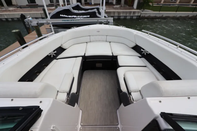 Slide: The Image of 2018 Regal 29 OBX boat interior with spacious white seating and sleek design. - 33