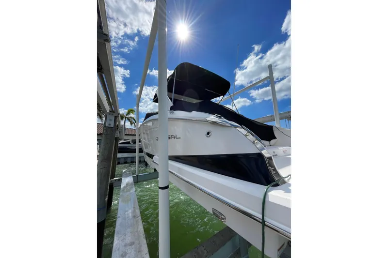 Slide: The Image of 2018 Regal 29 OBX boat docked under sunny blue sky. - 5