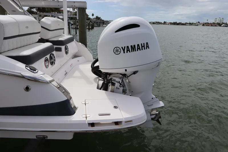 Slide: The Image of 2018 Regal 29 OBX boat with Yamaha outboard motor on water. - 8