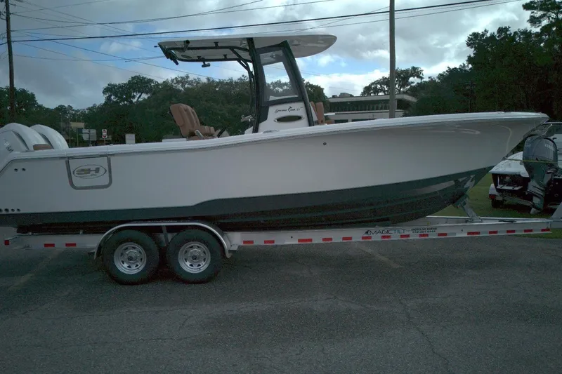 The Image of 2026 Sea Hunt Gamefish 27 Coffin Box boat on trailer, side view. - 0