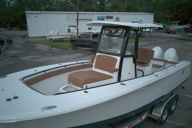 Slide: The Image of 2026 Sea Hunt Gamefish 27 Coffin Box boat with dual engines and spacious seating. - 10