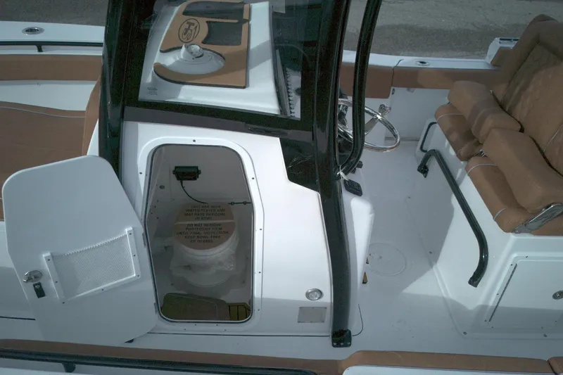 Slide: The Image of 2026 Sea Hunt Gamefish 27 Coffin Box interior with open storage compartment and seating. - 7