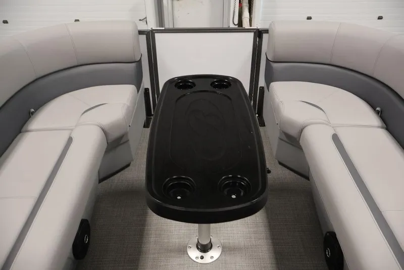 Slide: The Image of Interior of 2026 Bentley Pontoons 240 Swingback with plush seating and central table. - 14