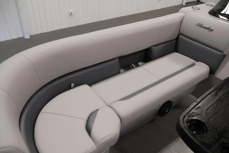 Slide: The Image of Luxurious seating on 2026 Bentley Pontoons 240 Swingback, featuring elegant gray upholstery. - 17