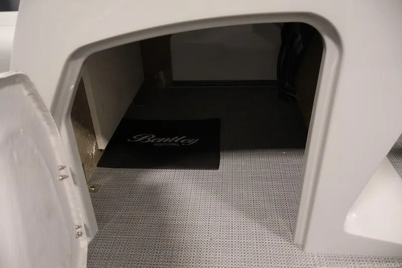 Slide: The Image of Interior view of 2026 Bentley Pontoons 240 Swingback, featuring a carpeted floor and branded mat. - 19