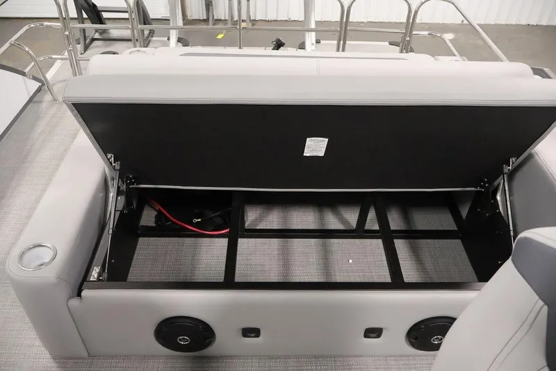 Slide: The Image of 2026 Bentley Pontoons 240 Swingback storage compartment with open seat revealing interior space. - 24