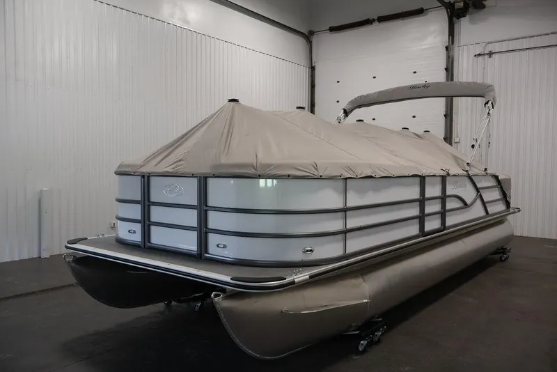 Slide: The Image of 2026 Bentley Pontoons 240 Swingback covered in a storage facility. - 29