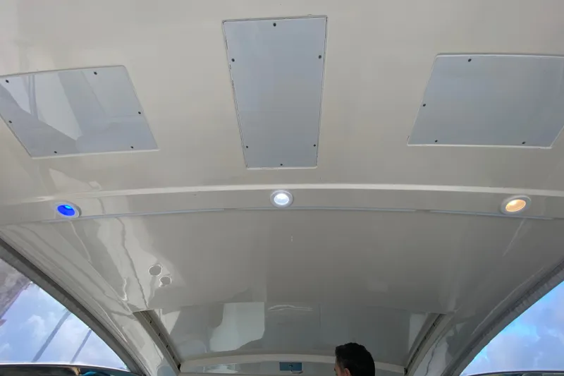 Slide: The Image of 2014 Pursuit SC 365i Sport Coupe helm with modern controls and seating. - 38