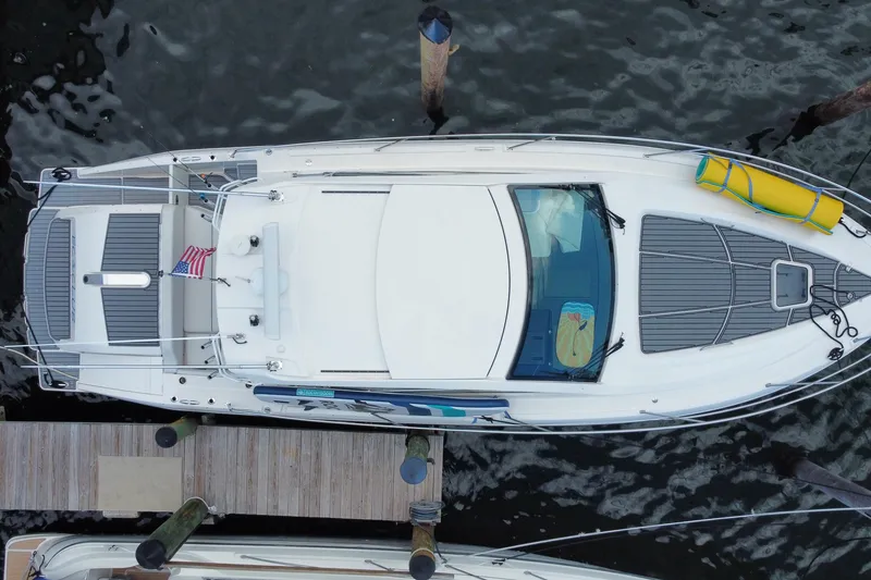 Slide: The Image of Overhead view of 2014 Pursuit SC 365i Sport Coupe docked at a marina. - 59