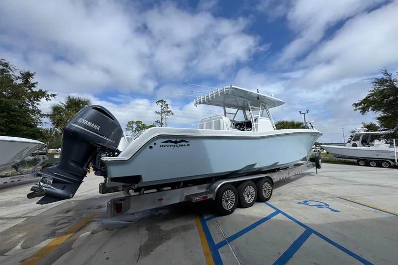 Slide: The Image of 2019 Invincible 39 Open Fisherman boat on trailer with Yamaha outboard motor. - 10