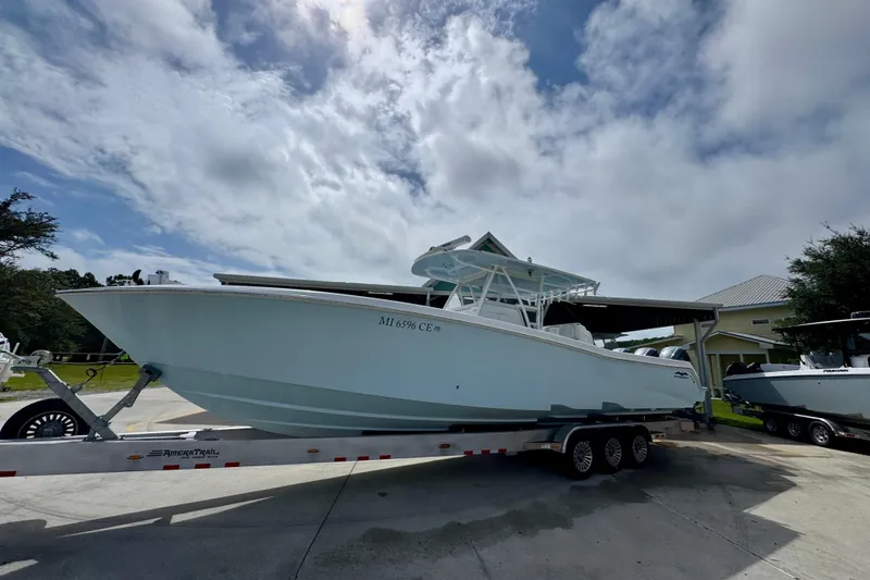 Slide: The Image of 2019 Invincible 39 Open Fisherman boat on trailer under cloudy sky. - 3