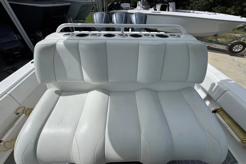 Slide: The Image of 2019 Invincible 39 Open Fisherman boat with white cushioned seating and cup holders. - 30