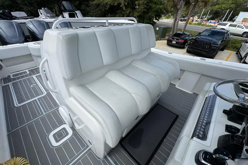 Slide: The Image of 2019 Invincible 39 Open Fisherman boat interior with white seating and modern controls. - 36