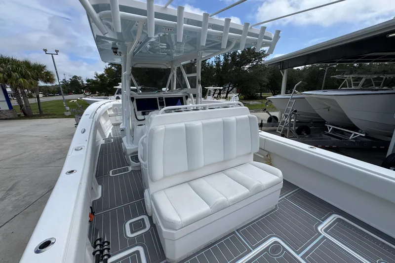 Slide: The Image of 2019 Invincible 39 Open Fisherman boat with white seating and sleek deck design. - 37