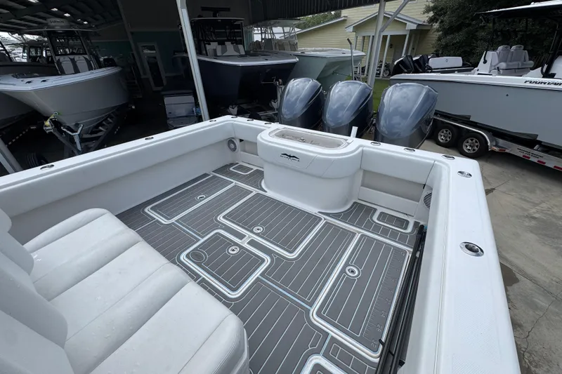 Slide: The Image of 2019 Invincible 39 Open Fisherman boat interior with sleek deck design and powerful engines. - 40