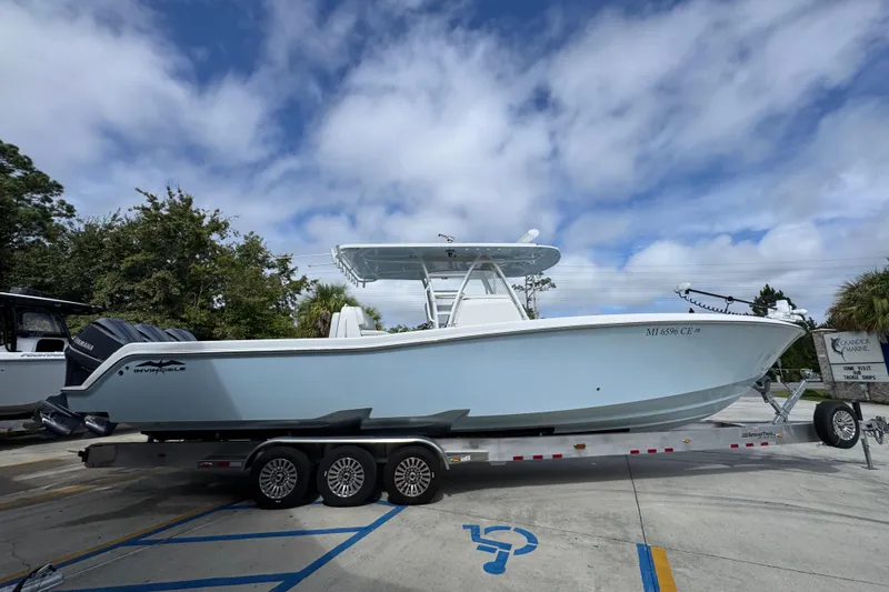 Slide: The Image of 2019 Invincible 39 Open Fisherman boat on trailer under cloudy sky. - 9