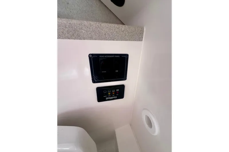 Slide: The Image of Control panel inside 2001 Wellcraft 290 Coastal boat cabin. - 18