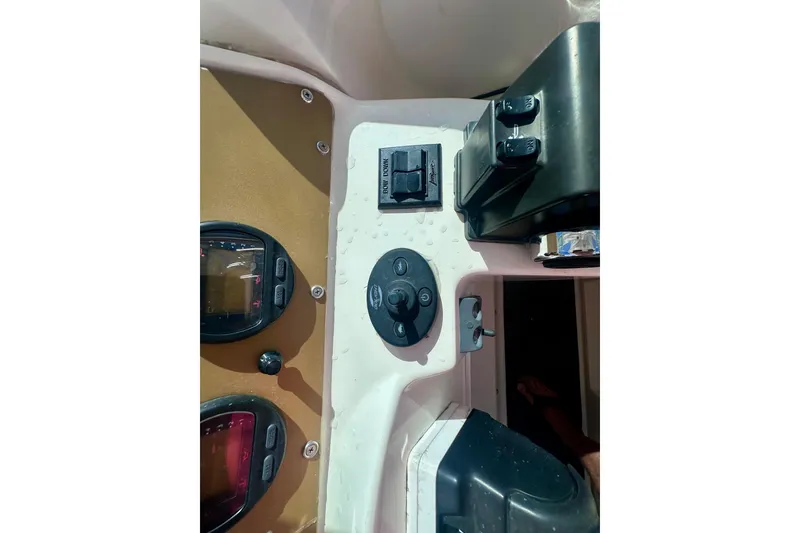 Slide: The Image of Control panel of 2001 Wellcraft 290 Coastal boat with switches and gauges. - 26