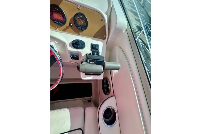 Slide: The Image of 2001 Wellcraft 290 Coastal boat dashboard with Yamaha controls and gauges. - 27