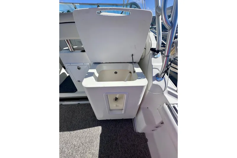 Slide: The Image of 2001 Wellcraft 290 Coastal boat interior with open storage compartment. - 33