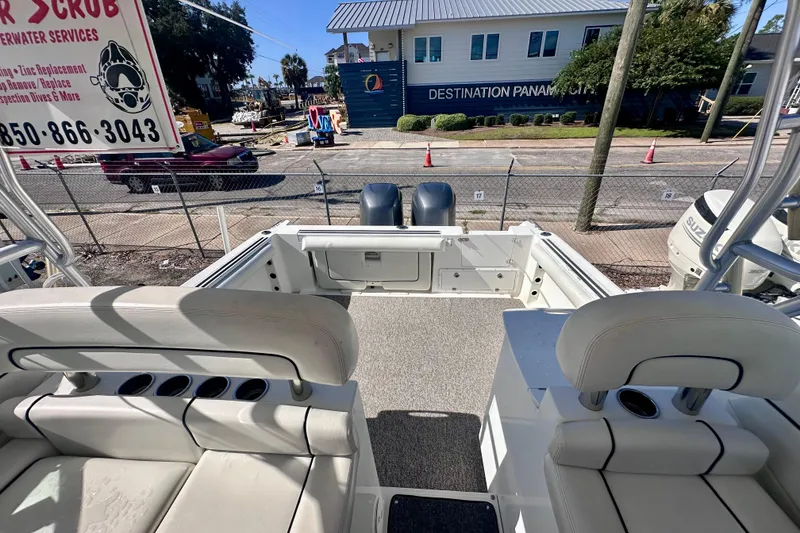 Slide: The Image of 2001 Wellcraft 290 Coastal boat interior with seating and dual outboard motors. - 34