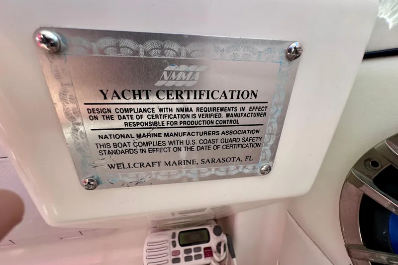 Slide: The Image of Yacht certification plaque on 2001 Wellcraft 290 Coastal, verifying NMMA compliance. - 36