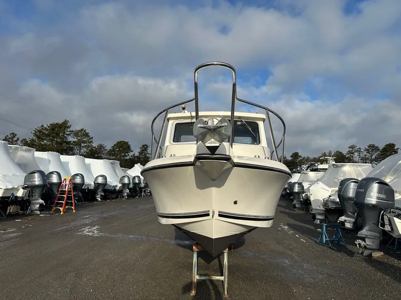 Slide: The Image of 2024 Defiance 220 Admiral EX boat in a parking lot. - 31