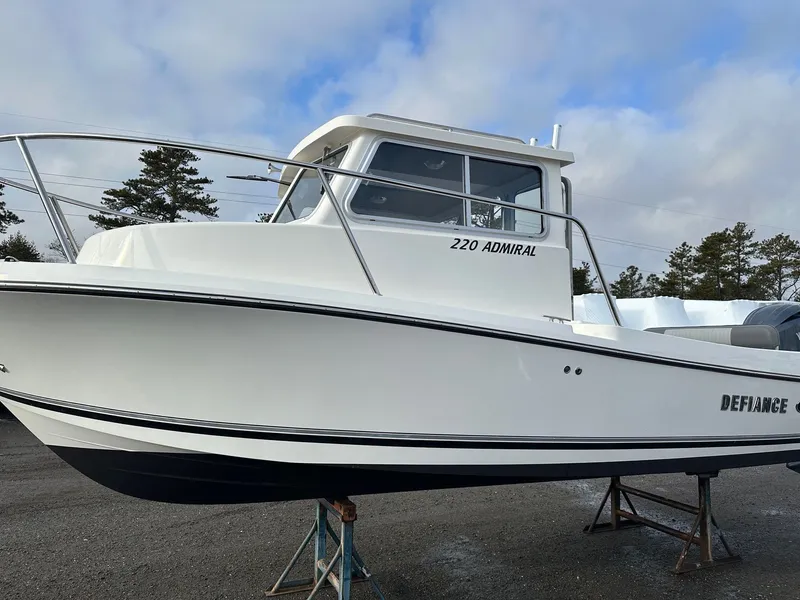 Slide: The Image of 2024 Defiance 220 Admiral EX boat on a stand. - 33