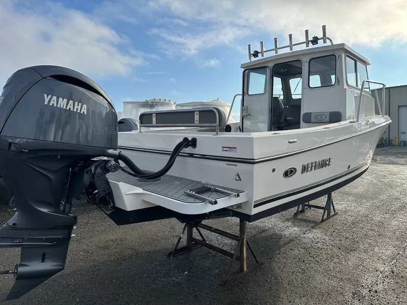 Slide: The Image of Defiance 220 Admiral EX 2024 with Yamaha engine on stands. - 36