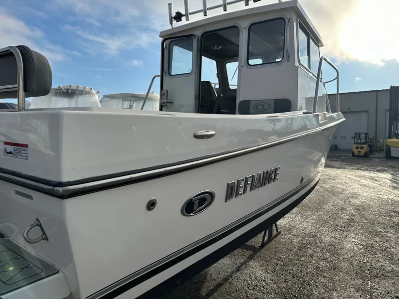 Slide: The Image of 2024 Defiance 220 Admiral EX boat outdoors. - 37
