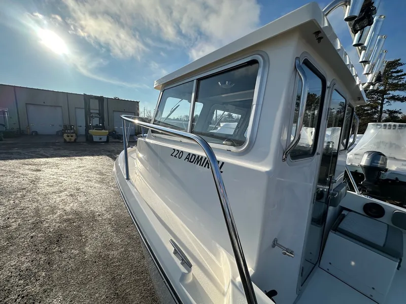 Slide: The Image of Defiance 220 Admiral EX 2024 boat outdoors in sunlight. - 38