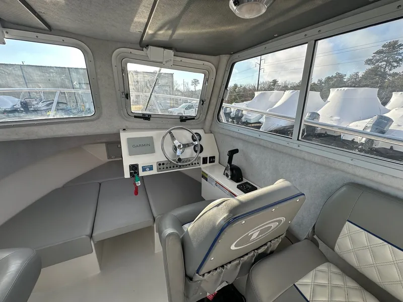 Slide: The Image of Interior of the 2024 Defiance 220 Admiral EX boat. - 43