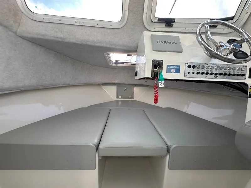 Slide: The Image of Interior of 2024 Defiance 220 Admiral EX with helm console. - 47