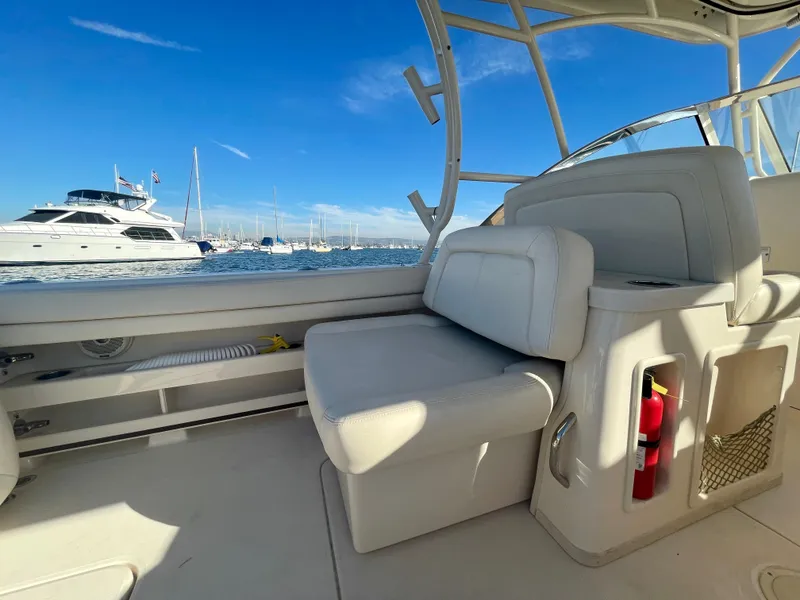 Slide: The Image of 2017 Grady-White 307 Freedom boat interior with ocean view and yachts in background. - 11
