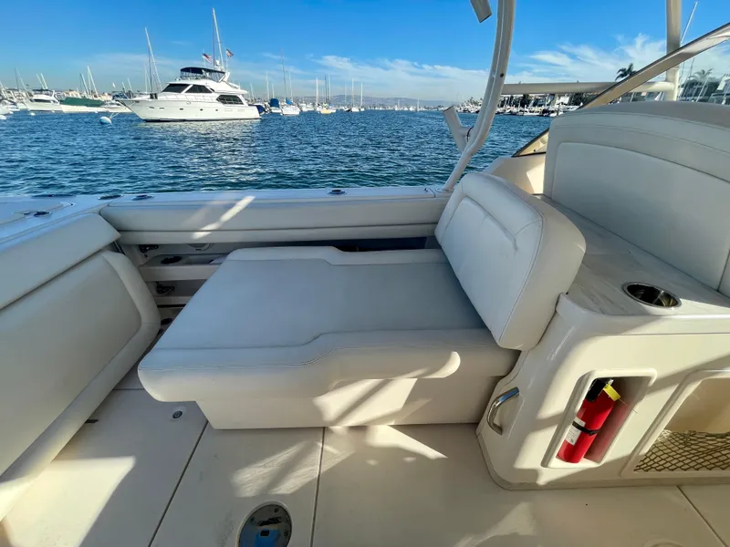 Slide: The Image of 2017 Grady-White 307 Freedom boat interior with seating, docked in a marina. - 12
