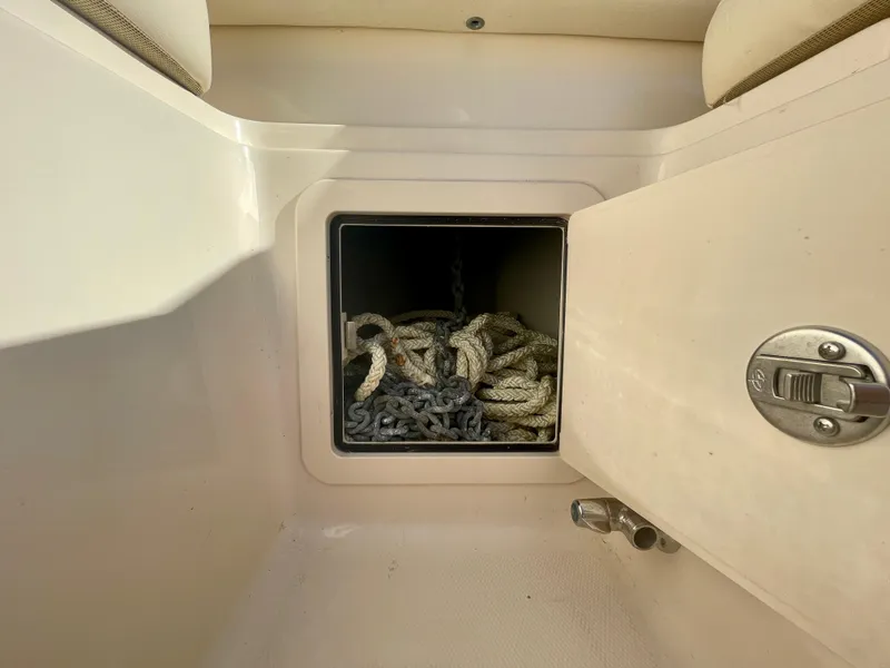 Slide: The Image of 2017 Grady-White 307 Freedom boat storage compartment with ropes inside. - 26