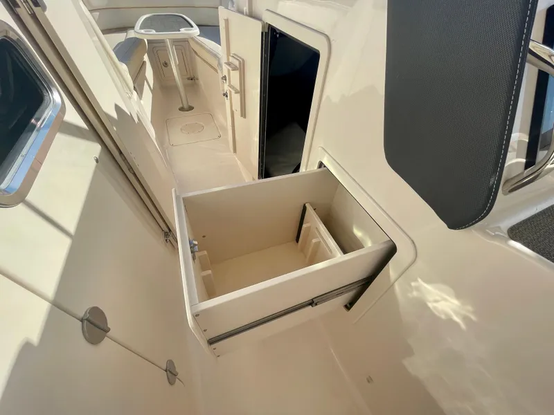 Slide: The Image of 2017 Grady-White 307 Freedom boat interior with open storage compartment. - 31