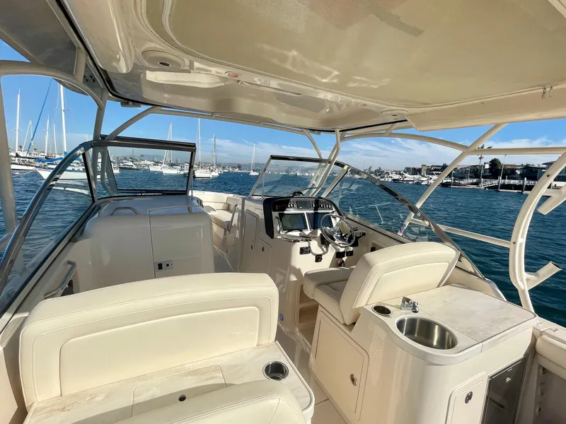 Slide: The Image of 2017 Grady-White 307 Freedom boat interior with helm, seating, and ocean view. - 34