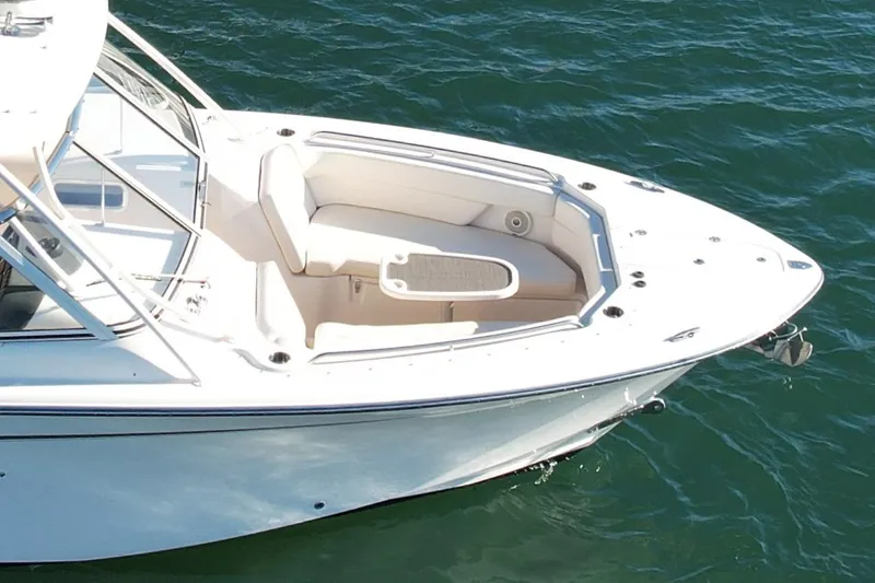 Slide: The Image of 2017 Grady-White Freedom 307 boat on water, featuring spacious seating area. - 8