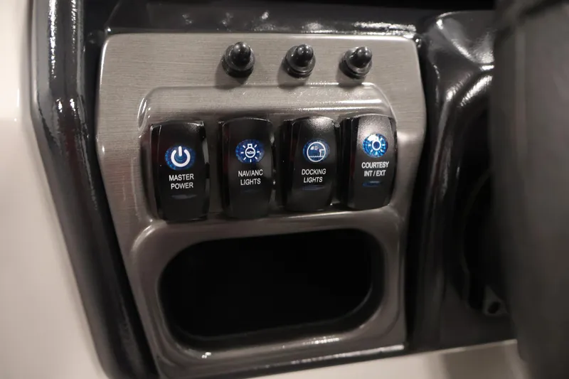 Slide: The Image of Control panel of 2026 Bentley Pontoons 240 Navigator with labeled switches. - 22