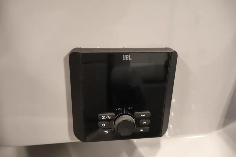 Slide: The Image of JBL audio control panel on 2026 Bentley Pontoons 240 Navigator. - 24