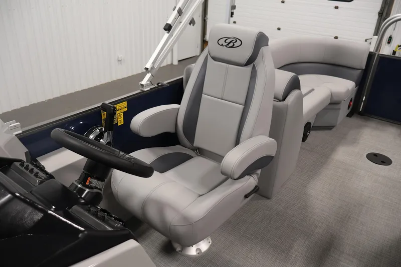 Slide: The Image of 2026 Bentley Pontoons 240 Navigator interior with luxurious seating and modern steering console. - 25