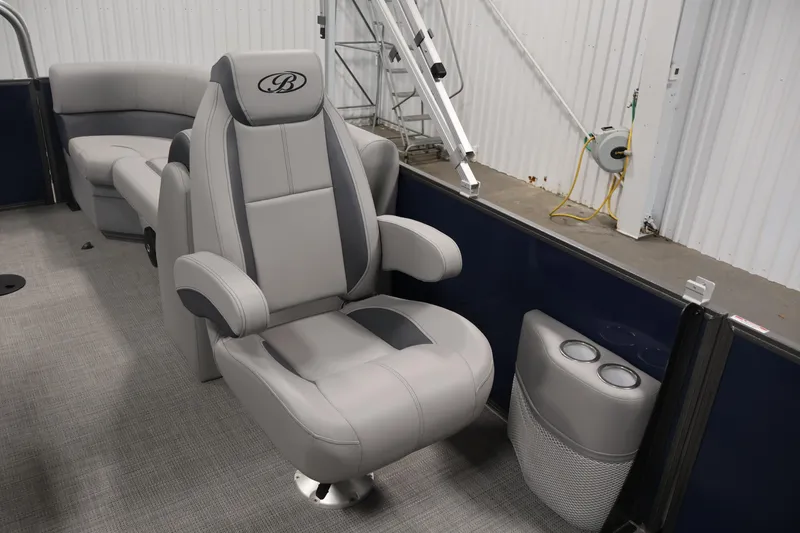 Slide: The Image of Luxurious seating on 2026 Bentley Pontoons 240 Navigator, featuring plush captain's chair. - 26
