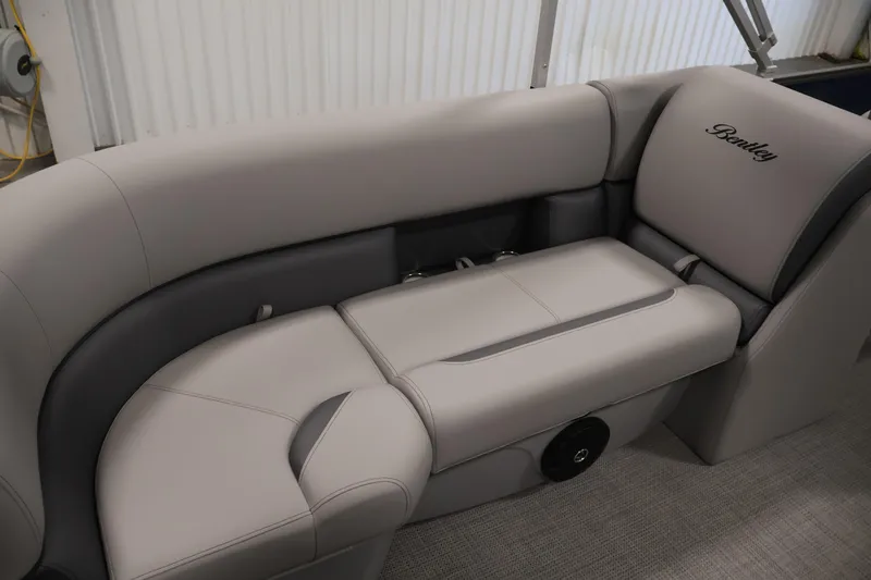 Slide: The Image of Luxurious seating in the 2026 Bentley Pontoons 240 Navigator, featuring elegant gray upholstery. - 28