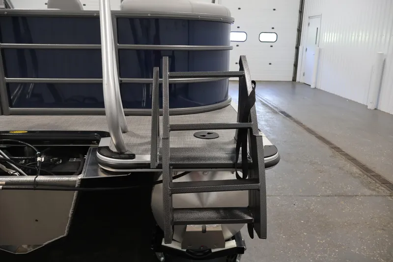 Slide: The Image of 2026 Bentley Pontoons 240 Navigator with rear ladder in a garage setting. - 35