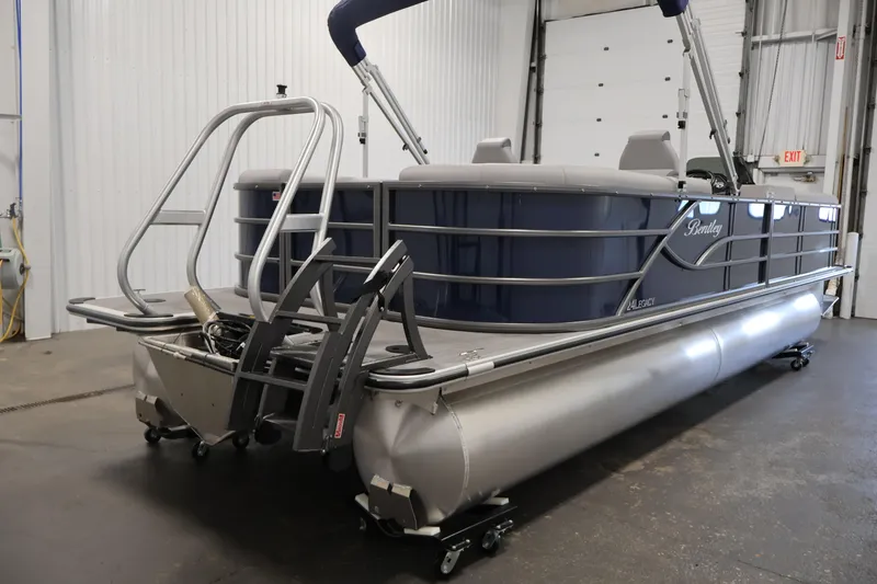 Slide: The Image of 2026 Bentley Pontoons 240 Navigator in a showroom, showcasing sleek design and modern features. - 4