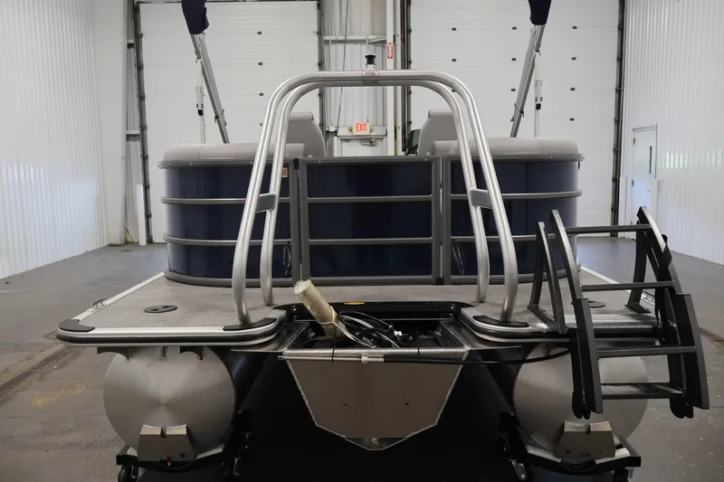Slide: The Image of 2026 Bentley Pontoons 240 Navigator in a warehouse, rear view with ladder and railing. - 5