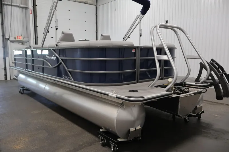 Slide: The Image of 2026 Bentley Pontoons 240 Navigator in a showroom, showcasing sleek design and modern features. - 6