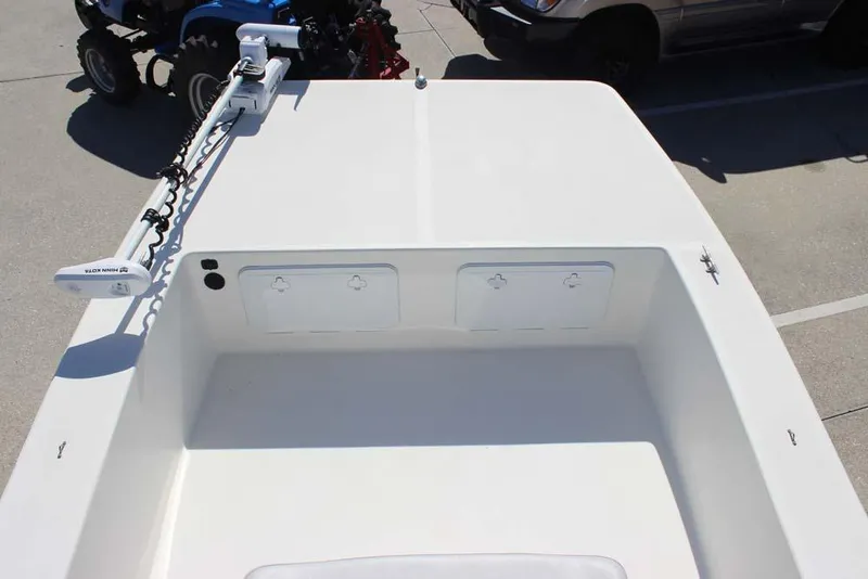 Slide: The Image of 2019 Bay Rider 2060 Skiff boat deck with storage compartments and trolling motor. - 14