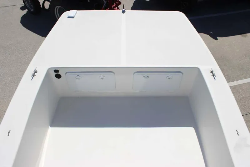 Slide: The Image of 2019 Bay Rider 2060 Skiff boat interior, featuring storage compartments and a clean deck design. - 15